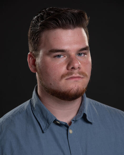 Dramatic headshot with beard